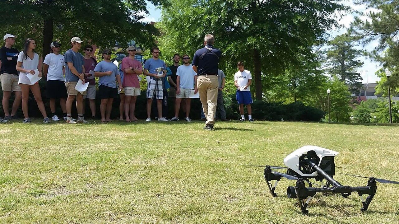 Outdoor class learning about drones