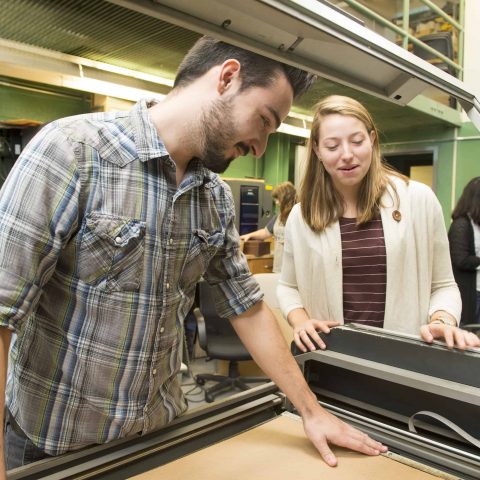 SIGD Students working with equipment in shop