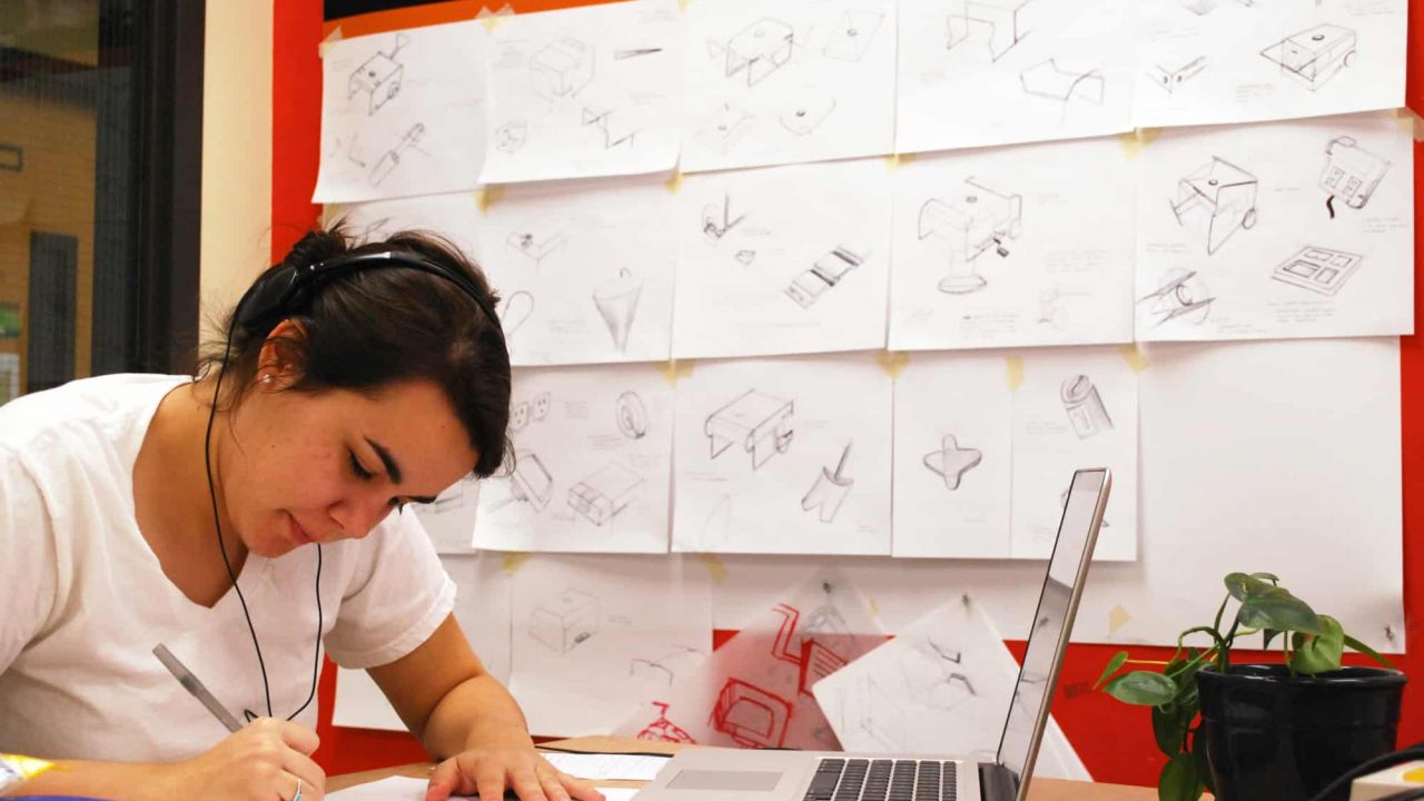 Industrial design student working on project in studio
