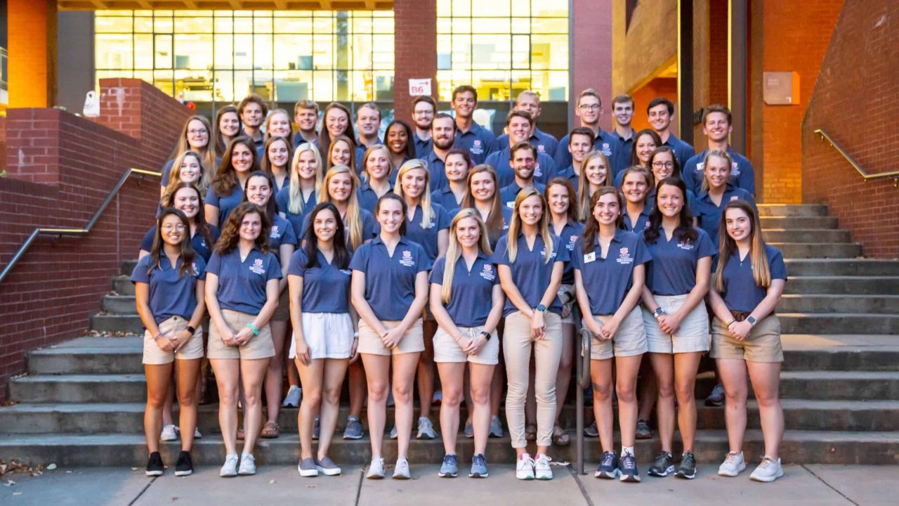 Ambassadors Standing on the front steps of Dudley Hall