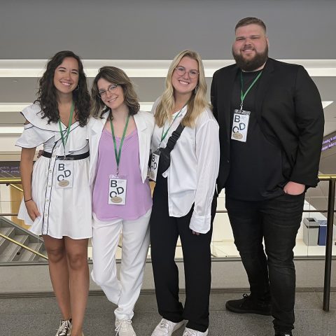 Graphic Design students Grace Lovell, Alyssa Jackson, Erika Donley and Zach Smith at the 2023 Biodesign Summit
