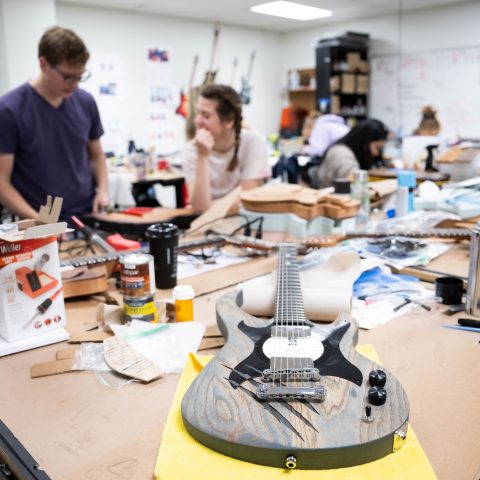 Guitar in Industrial Design studio with students working