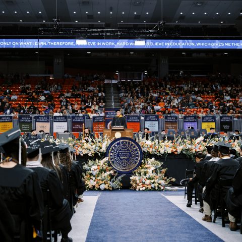 Tom Dempsey '89 addresses Auburn University graduates at the Fall 2023 commencement ceremony