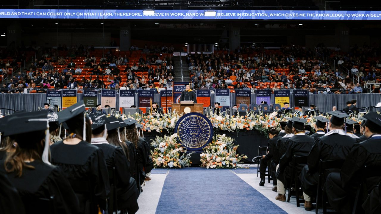 Tom Dempsey '89 addresses Auburn University graduates at the Fall 2023 commencement ceremony