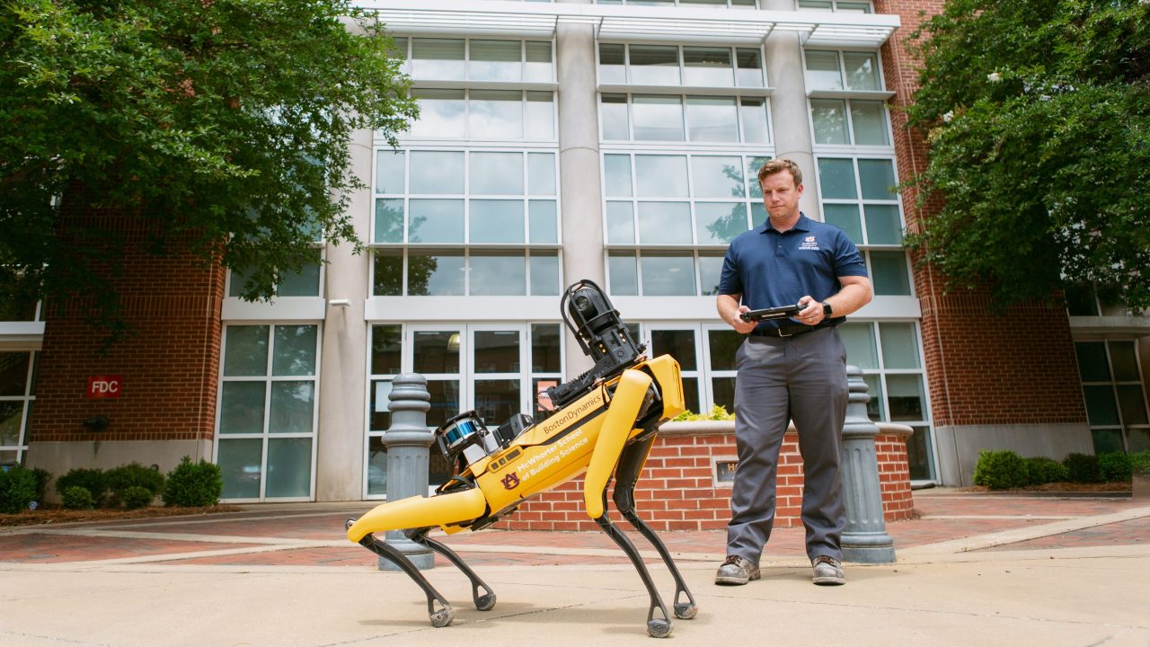 Associate Professor Eric Wetzel and Mac on Auburn University's campus.