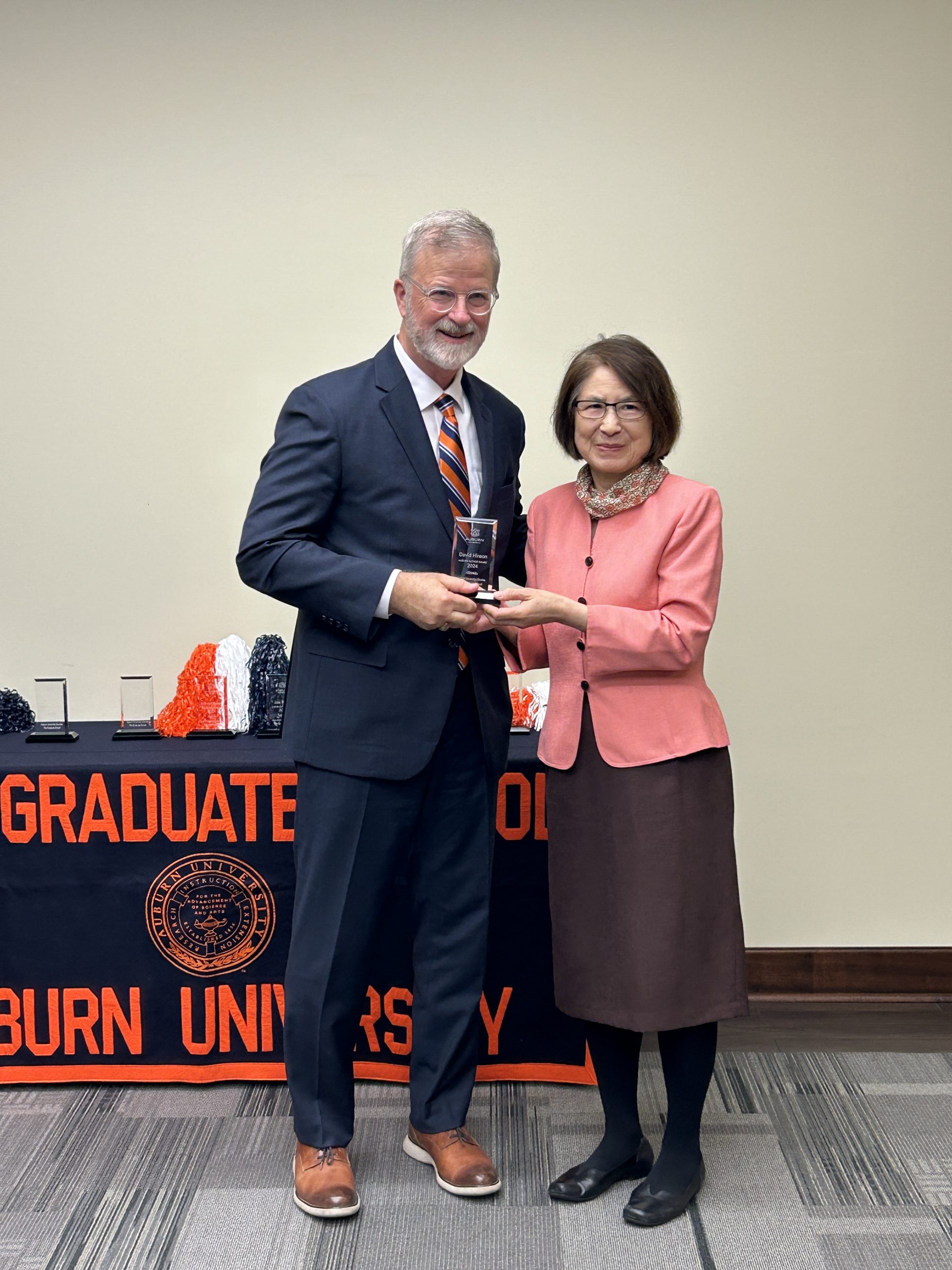 David Hinson accepting Auburn Author Award from Shali Zhang, Dean of Libraries