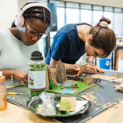 two students working on a Landscape Architecture model in studio