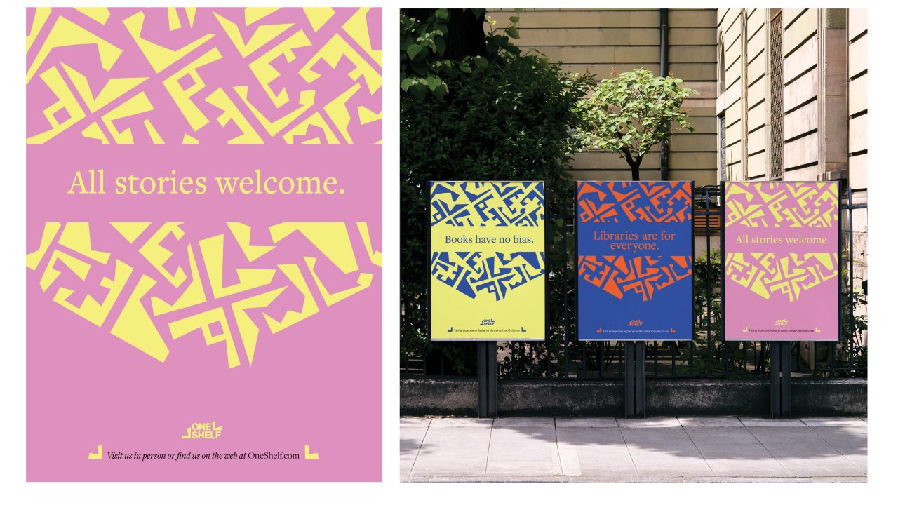 Three colorful posters on a sidewalk fence display messages promoting inclusion in libraries, including “All stories welcome,” “Libraries are for everyone,” and “Books have no bias.”.