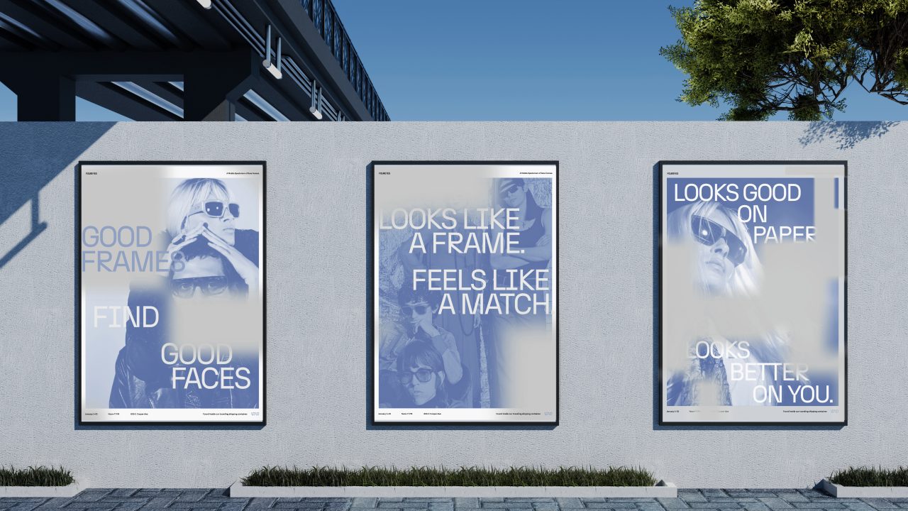 Three posters with blue-toned images and eyewear slogans are displayed on a concrete wall outdoors under a bridge, with a tree visible on the right.