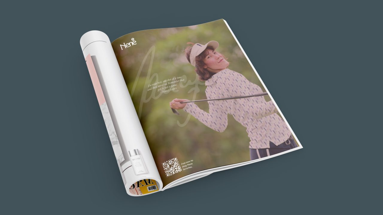 A magazine open to a full-page advertisement showing a person in golf attire swinging a golf club outdoors, with text and a QR code on the page.