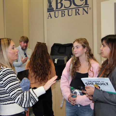 BSCI students speaking to a member of the National Association of Home Builders (NAHB)