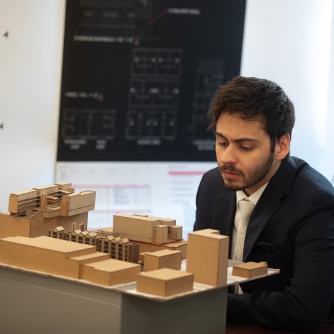 Urban Studio alum-juror Alex Hamady reviewing a student's model
