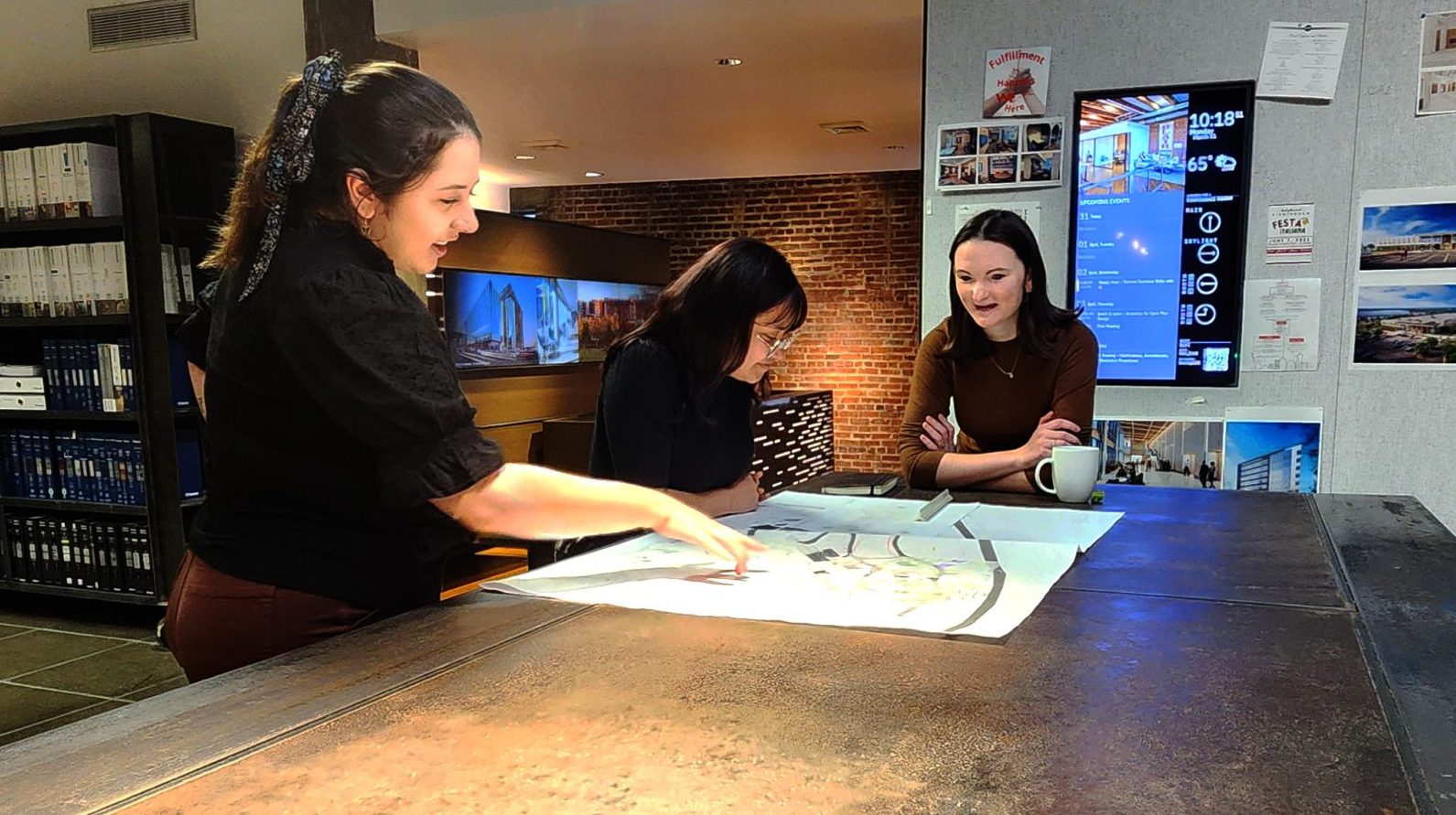 Laura Chavez working at her internship with Williams Blackstock Architects