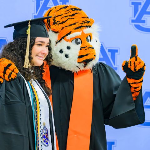 Auburn University graduate with Aubie