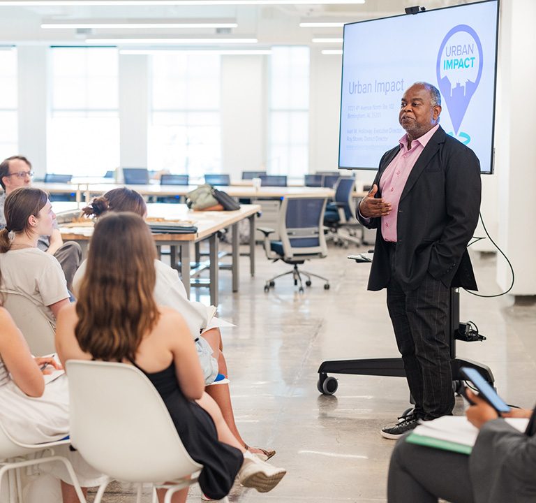 Roy Stoves of Urban Impact, Inc. speaks to students in Birmingham on their first day