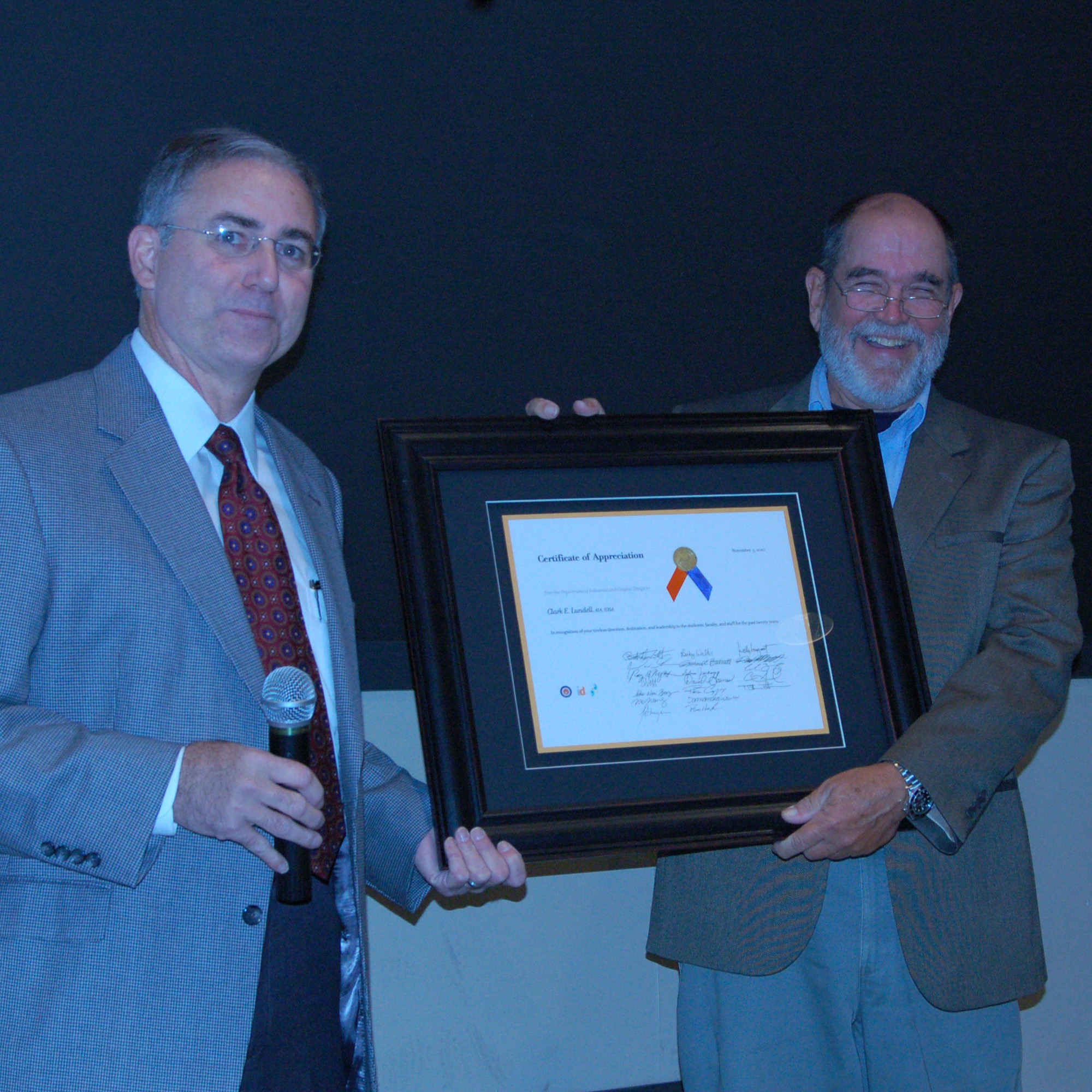 Clark Lundell (right) served as the head of the department from 1990 to 2013 and then as School Head until 2021. 