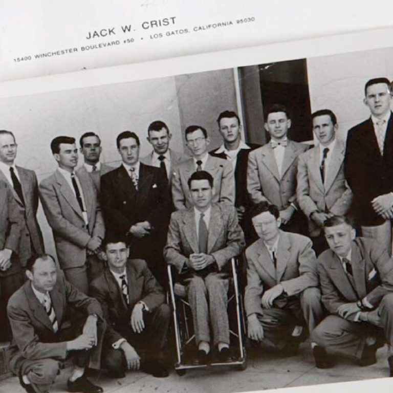 Jack Crist (center) poses with students in a group photo taken during his tenure as program head