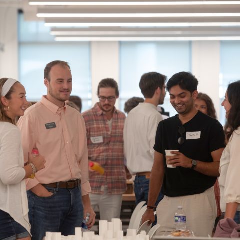 Seay Seay and Litchfield (sponsor) talking with alumni and students