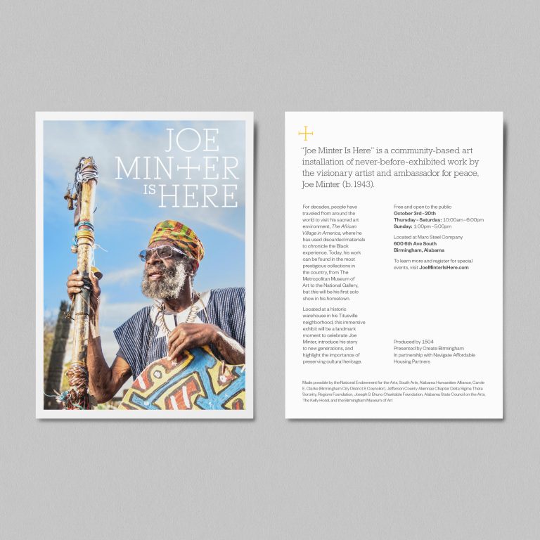 A printed flyer displays a man holding a decorated staff on the front and project information about “Joe Minter is Here” on the back, both set against a gray background.