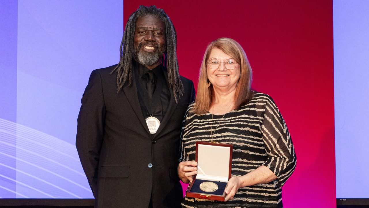 1. Kona Gray, FASLA, Principal, EDSA, ASLA President (left) stands with Charlene LeBleu, FASLA (right).