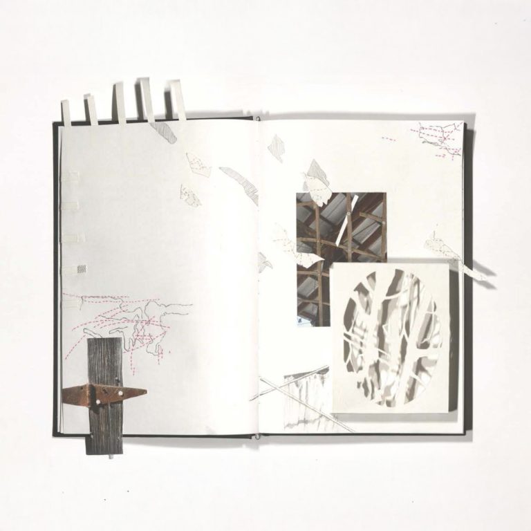An open sketchbook displays abstract line drawings, cut-out shapes, a circular cut-out, and two small photos of roof beams on white pages.