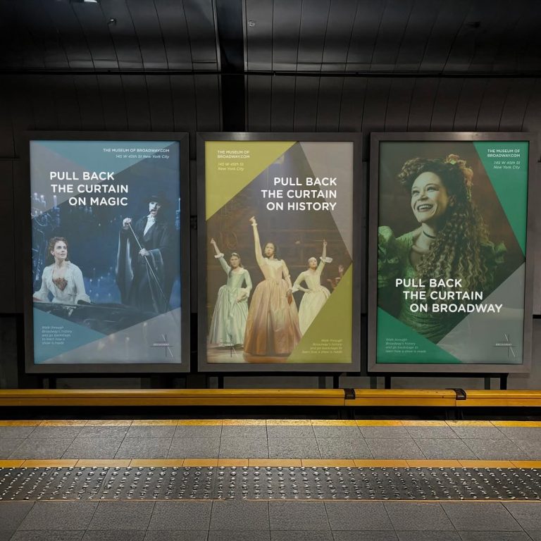 Three posters at a subway station promote Broadway shows with the phrases: Pull Back the Curtain on Magic, History, and Broadway, each featuring performers in costumes.