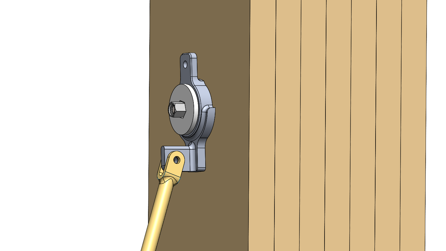 A lever arm is attached to a circular metal component mounted on a vertical wooden slat surface.