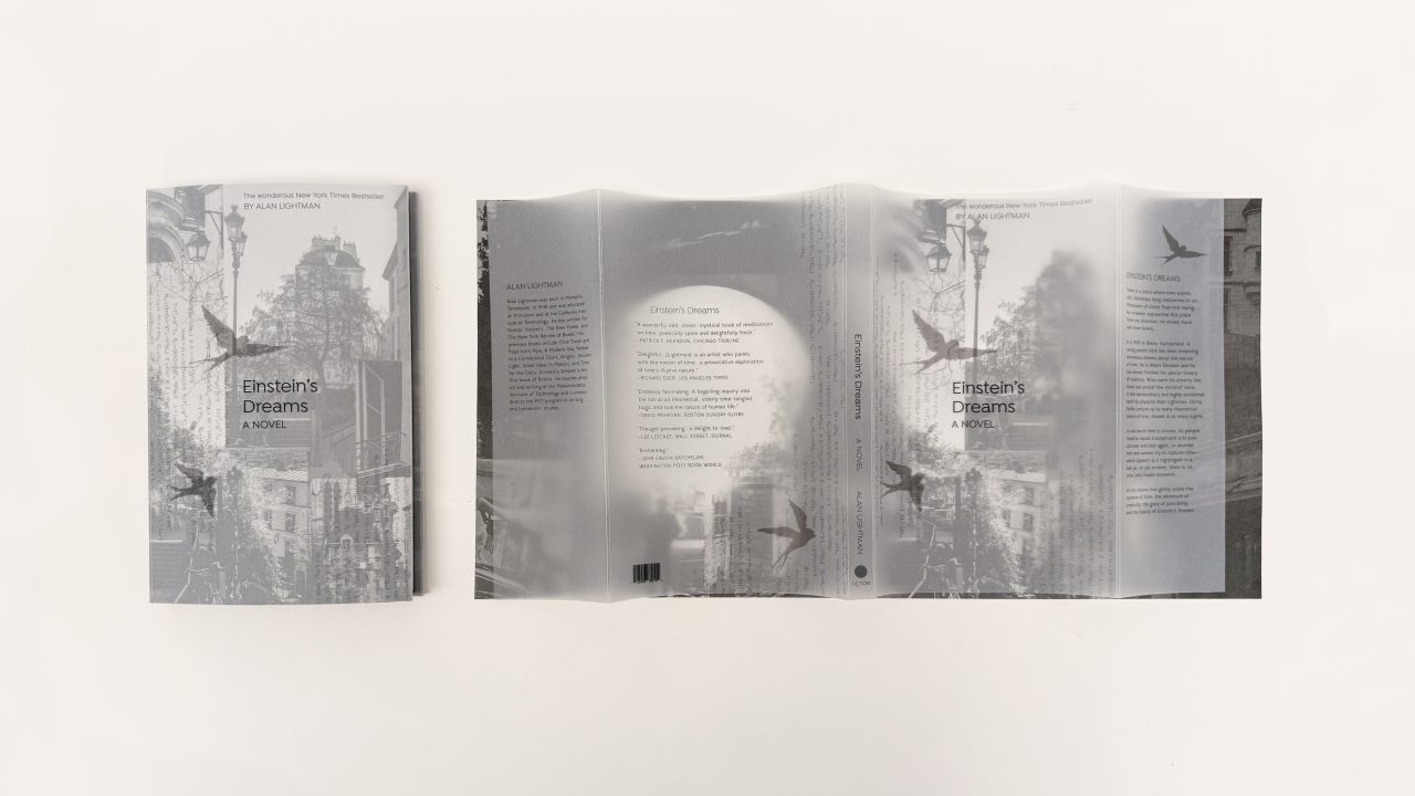 A grayscale book cover for Einsteins Dreams by Alan Lightman is shown, with the front, spine, and back visible. The design features city buildings and flying birds.