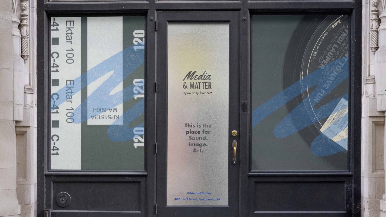 Storefront with large windows displaying film photography graphics and text reading Media & Matter, Open daily from 10, and This is the place for Sound. Image. Art.