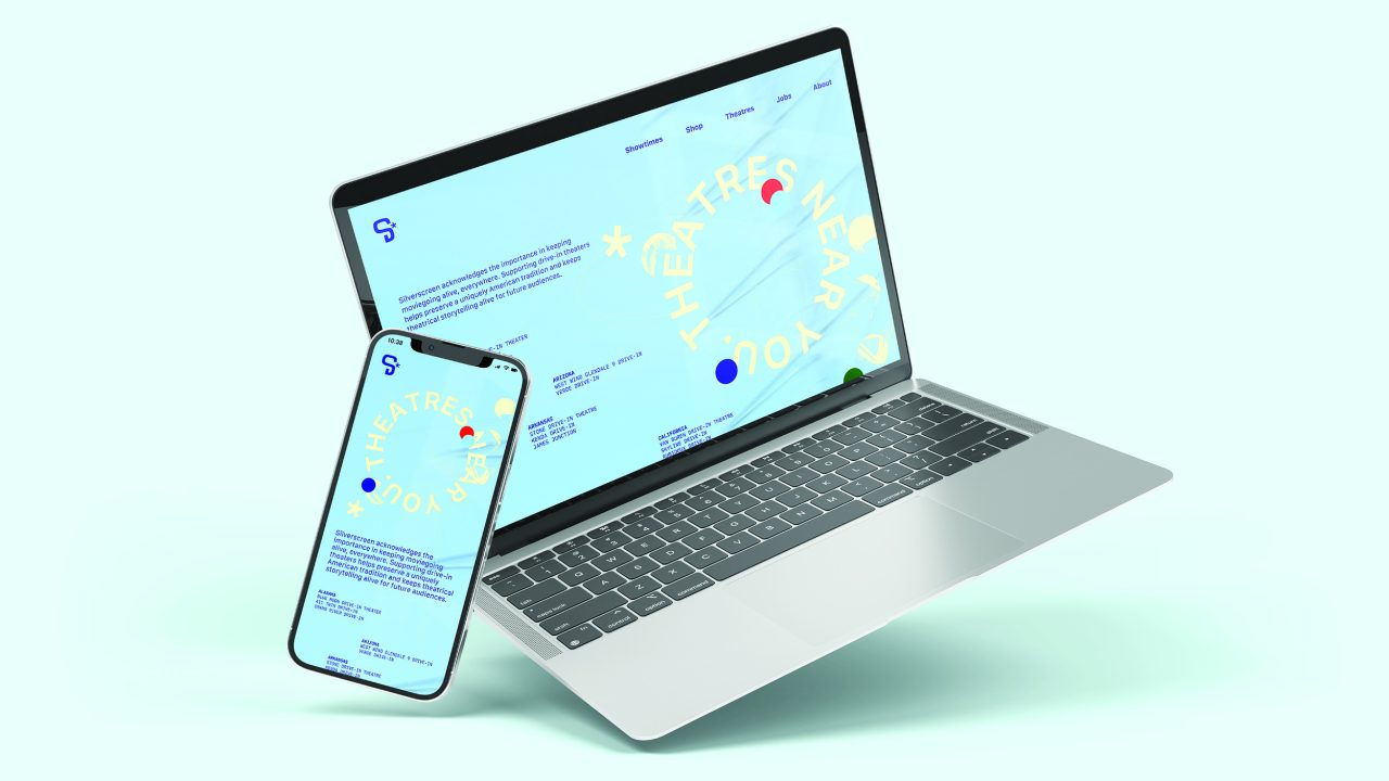 A laptop and smartphone display a website with blue text and circular yellow graphics reading THEATRE NEAR YOU on a light blue background.