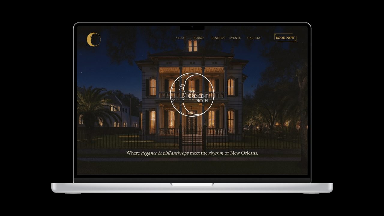 A laptop displays the homepage of The Crescent Hotel website, showing a lit historic building at night with navigation and booking options visible.