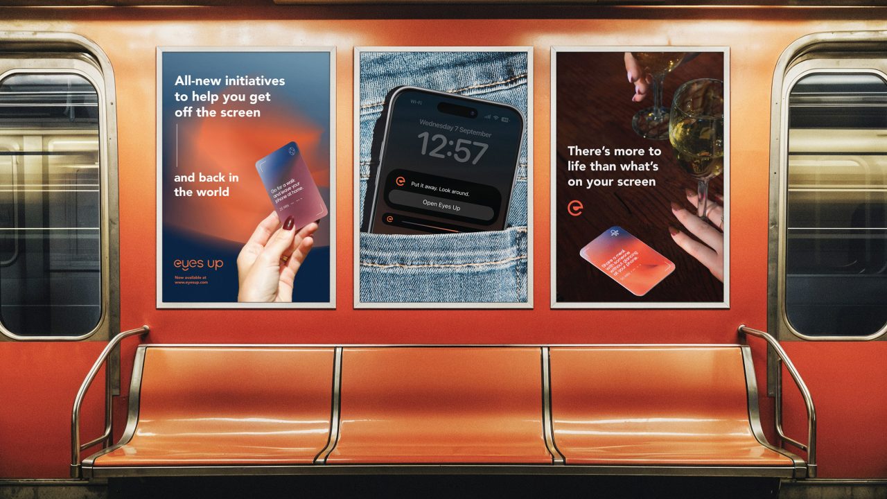 Three posters in a subway train promote the eyes up campaign, encouraging people to spend less time on screens and engage more with the real world.