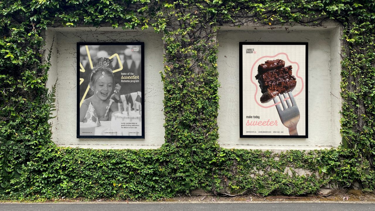 Two posters in a wall covered with green ivy; the left shows a smiling child at a birthday party, the right displays a close-up of a fork holding a piece of chocolate cake.
