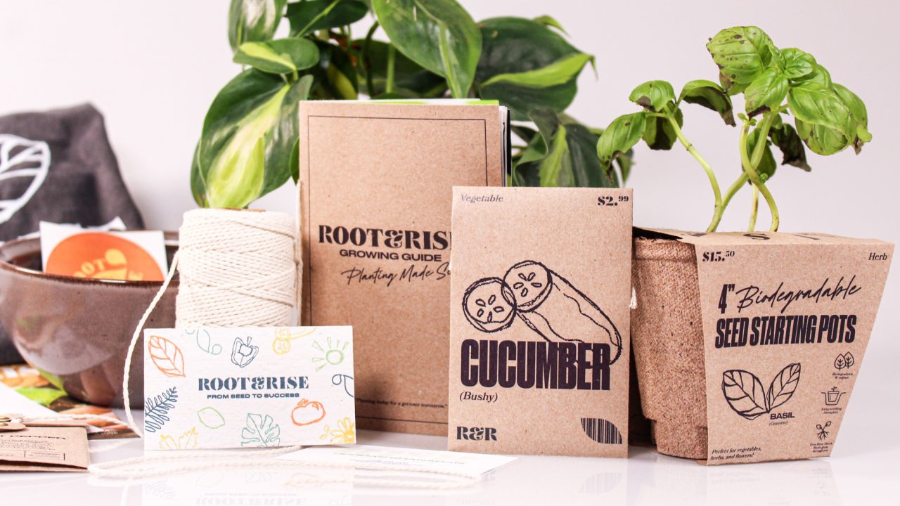 A collection of gardening supplies including seed packets, biodegradable pots, twine, a growing guide, and basil plants arranged on a white surface.