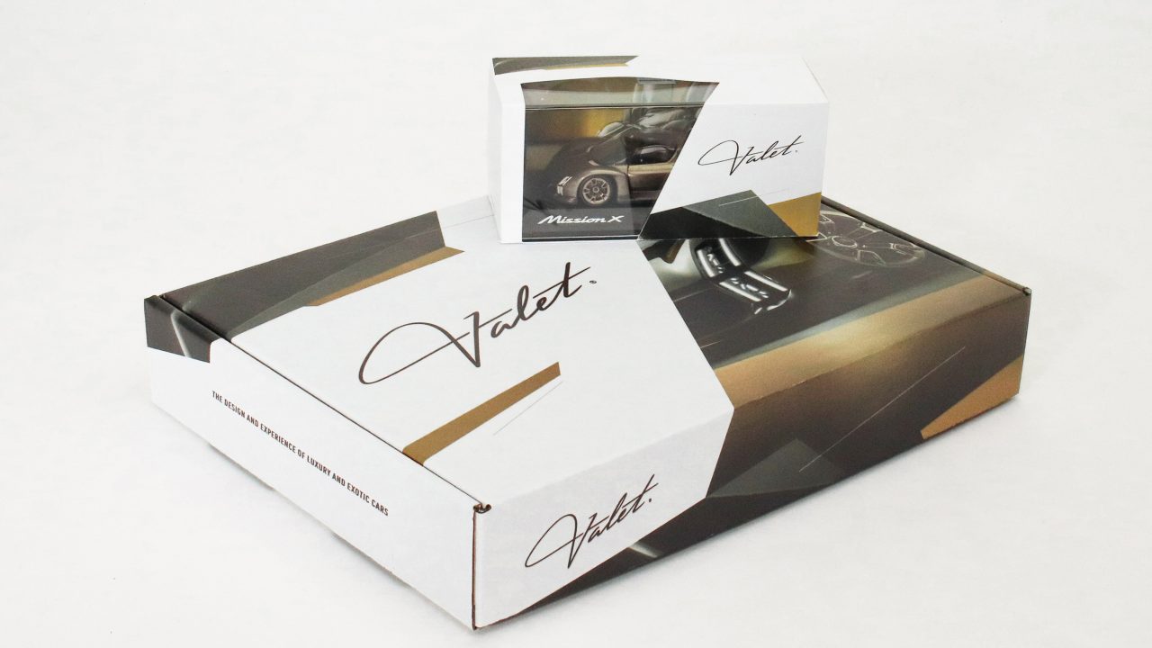 Two white and brown boxes, one large and one small, both labeled Valet, arranged on a white background.