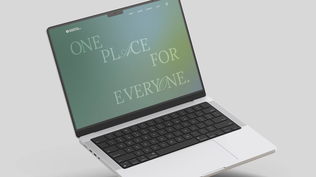 Open laptop displaying a green-blue screen with the text ONE PLACE FOR EVERYONE. in large, mixed-font letters on a plain background.