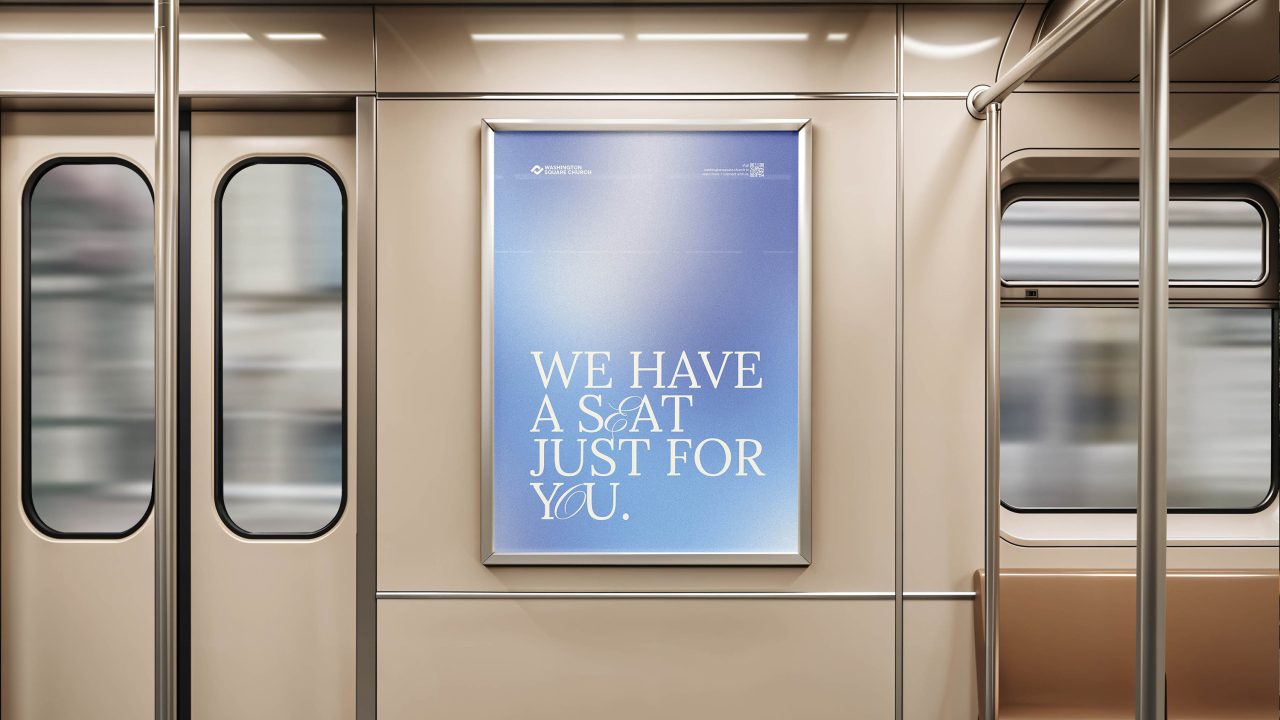 A subway car interior with a poster on the wall that reads, We have a seat just for you. The train doors and windows are visible.