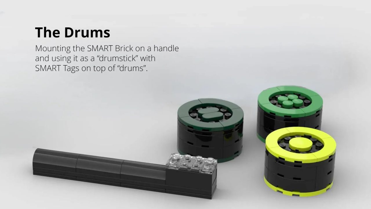 A LEGO handle with a SMART Brick is shown next to three round LEGO builds labeled as drums, each topped with green and yellow pieces.