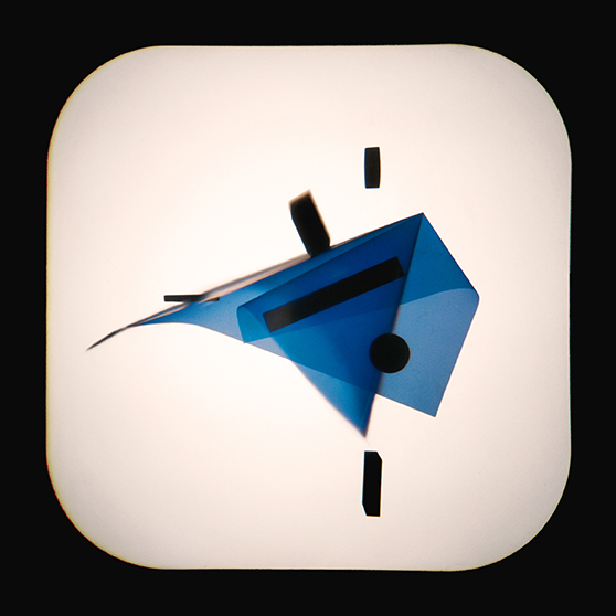 Abstract arrangement of translucent blue shapes and black rectangles on a white background, resembling geometric art under a spotlight.