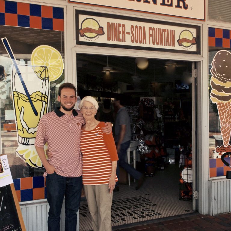Jenkins and his grandma in front of Toomers. 